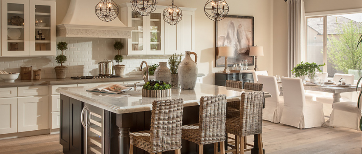 Kitchen with white cabinets and large island